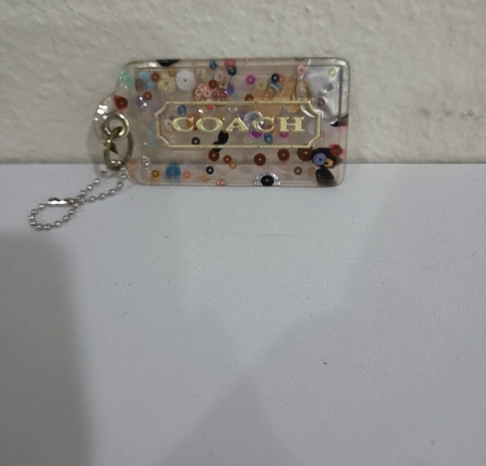 Coach Clear Confetti Acrylic Hang Tag  with Gold Logo